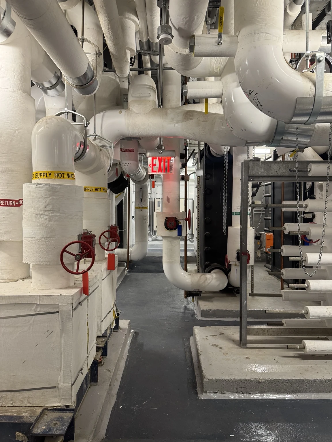 Hot-water mechanical room with insulated piping and valves